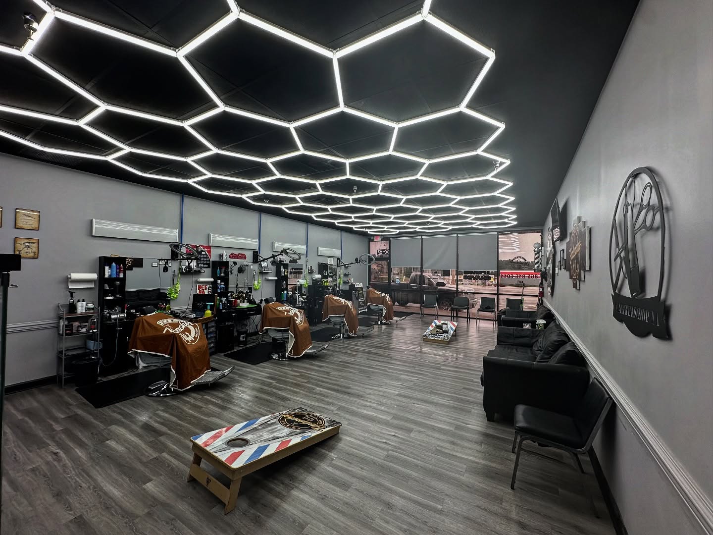 The Barbershop 11 interior with illuminated geometric ceiling lights